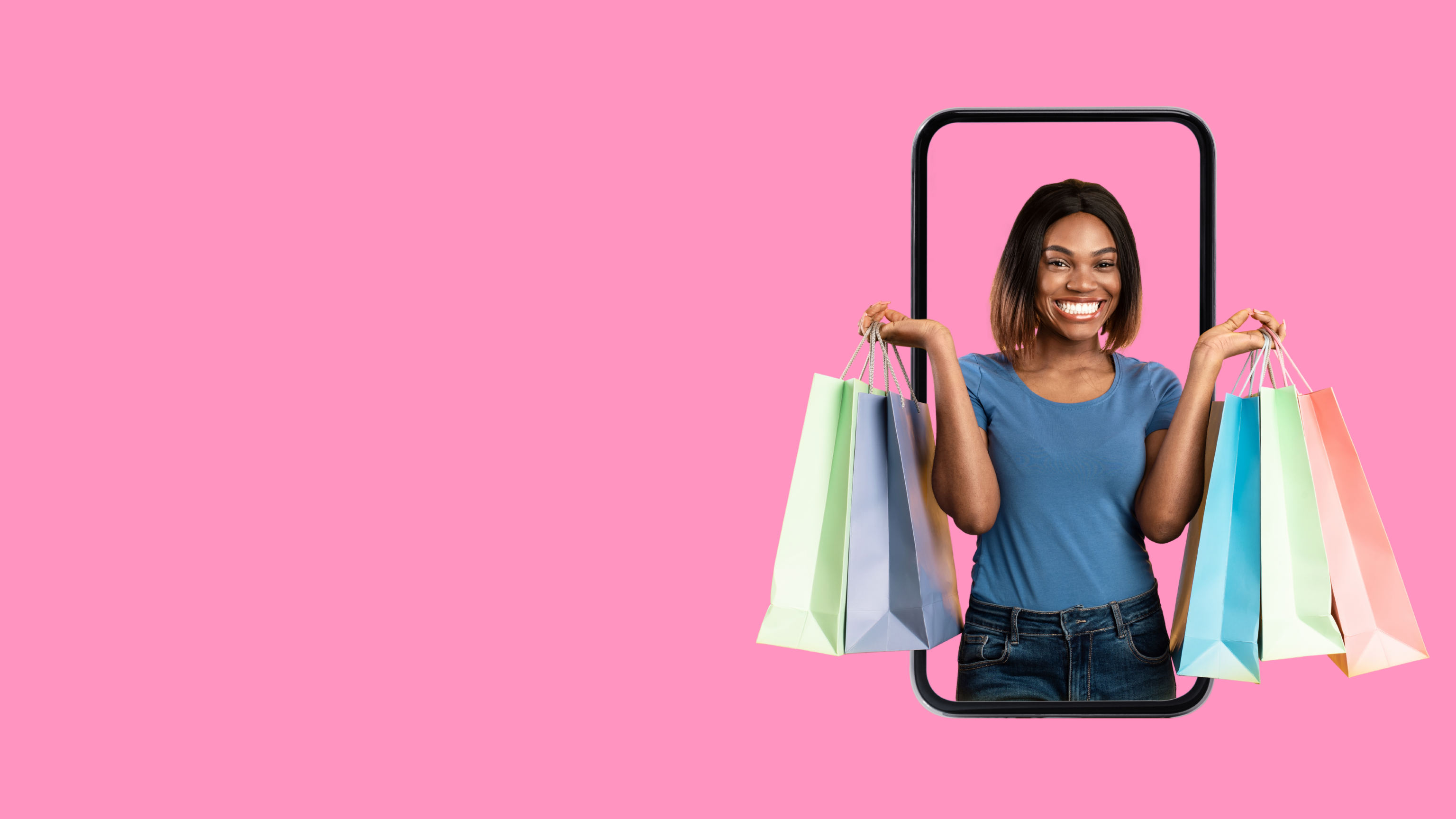 Woman holding shopping bags with a pink background
